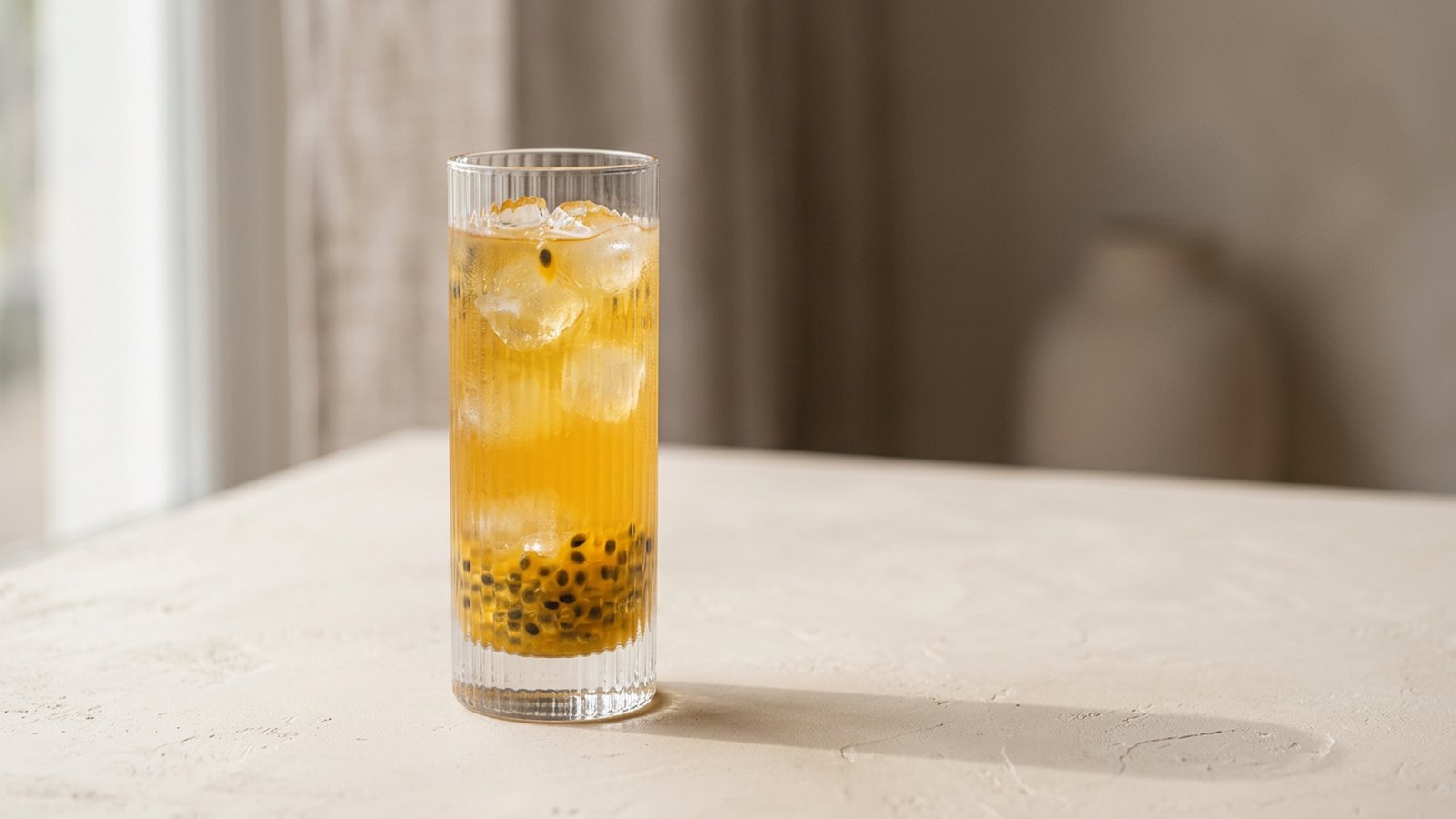 House-made passion fruit lemonade refresher in a fluted glass over ice at Krasivo Beauty Cafe